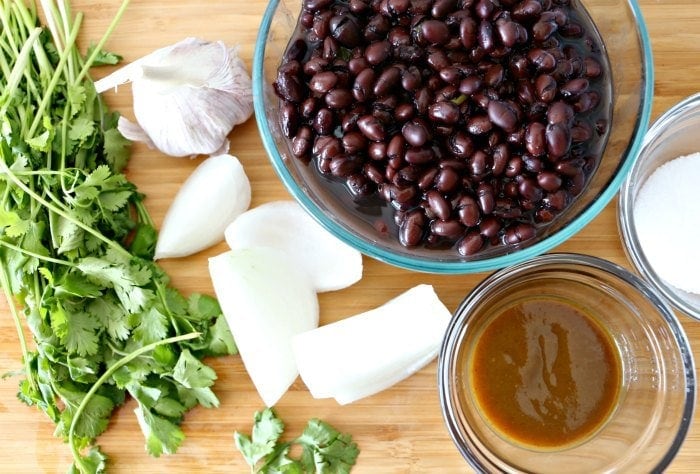 bean dip ingredients- black beans, cilantro, onion, garlic salt and salsa lizano