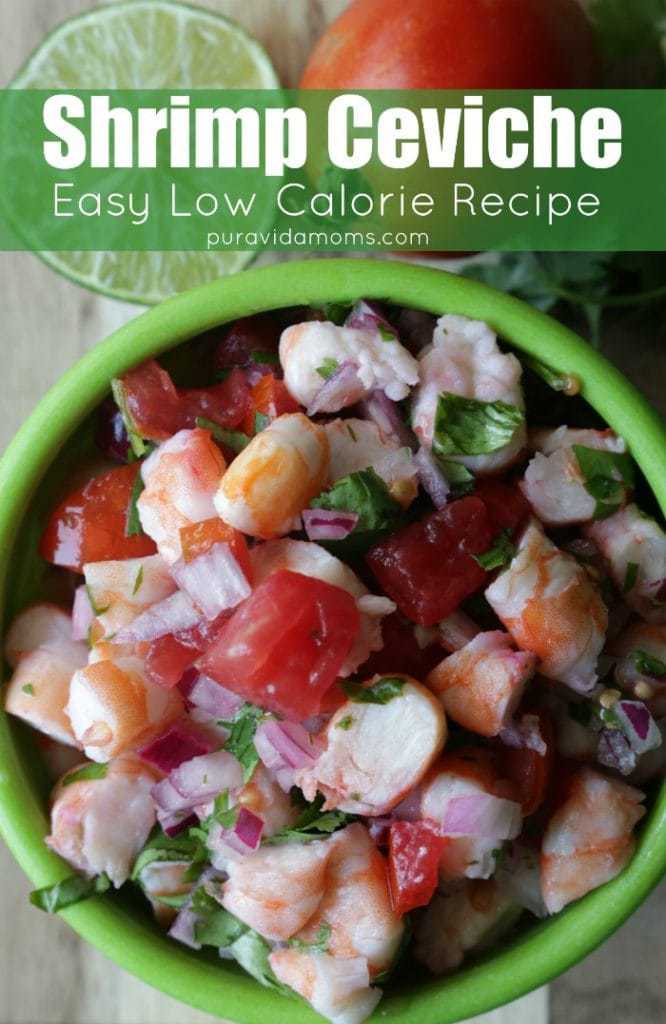 A mixed bowl of shrimp and other ingredients in a green bowl.
