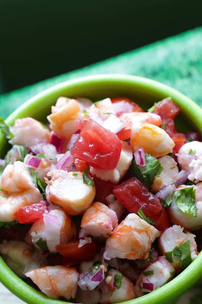 green bowl full of shrimp ceviche