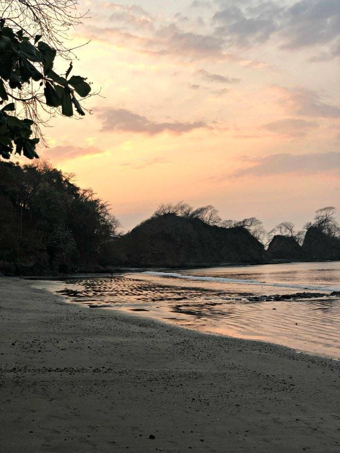 Looking for a quiet, off the beaten path beach just an 1 and 1/2 hours from San Jose, Playa Mantas Costa Rica is the place to go. Bathwater temperature, soft waves, and turquoise water- and did we mention few tourists? #costarica #familybeach #familytravel #costaricabeach #traveltips #puravida #puravidamoms #beachtips