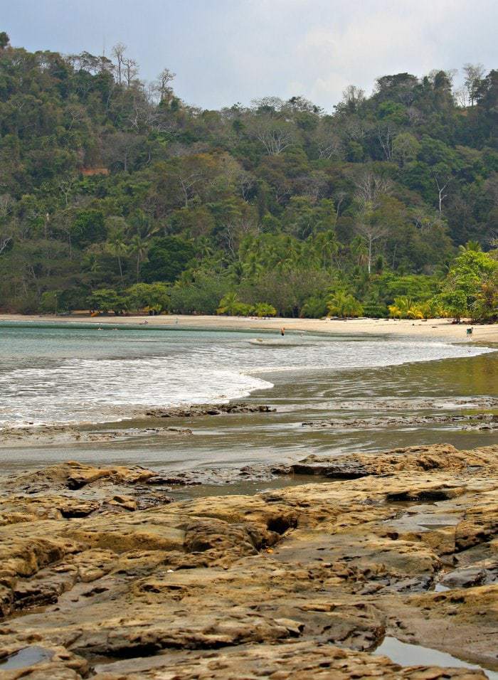 Looking for a quiet, off the beaten path beach just an 1 and 1/2 hours from San Jose, Playa Mantas Costa Rica is the place to go. Bathwater temperature, soft waves, and turquoise water- and did we mention few tourists? #costarica #familybeach #familytravel #costaricabeach #traveltips #puravida #puravidamoms #beachtips