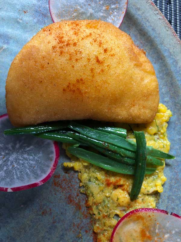Cheese empanada on grey plate at Don Rufino restaurant La Fortuna.