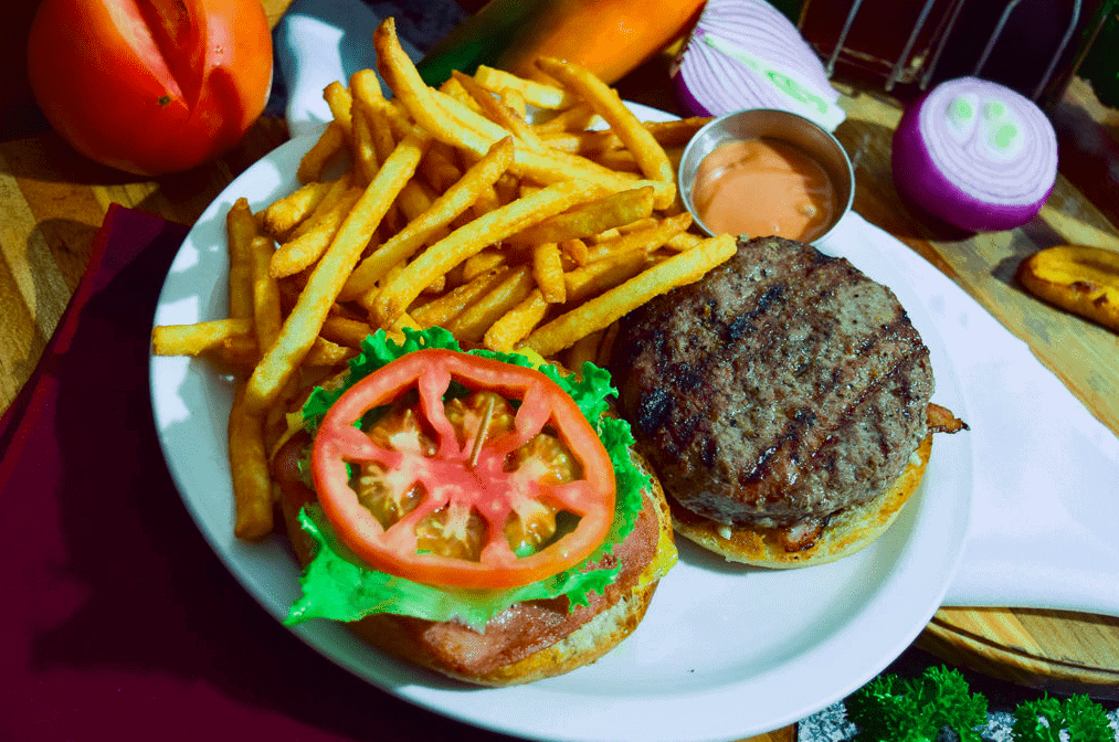 open faced hamburger and fries at nenes restaurant la fortuna