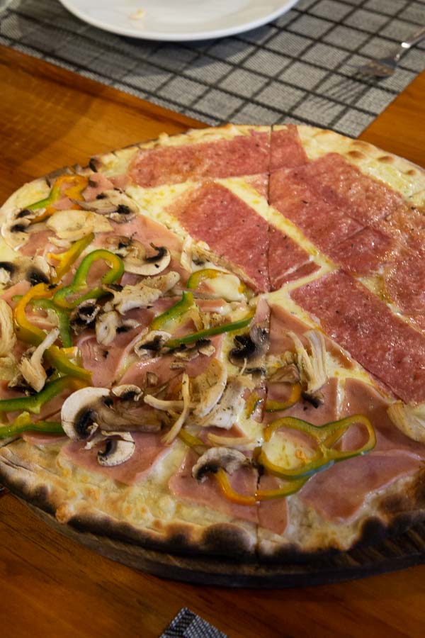 Half pepperoni half veggie pizza at Cafe Mediterranea Costa Rica.