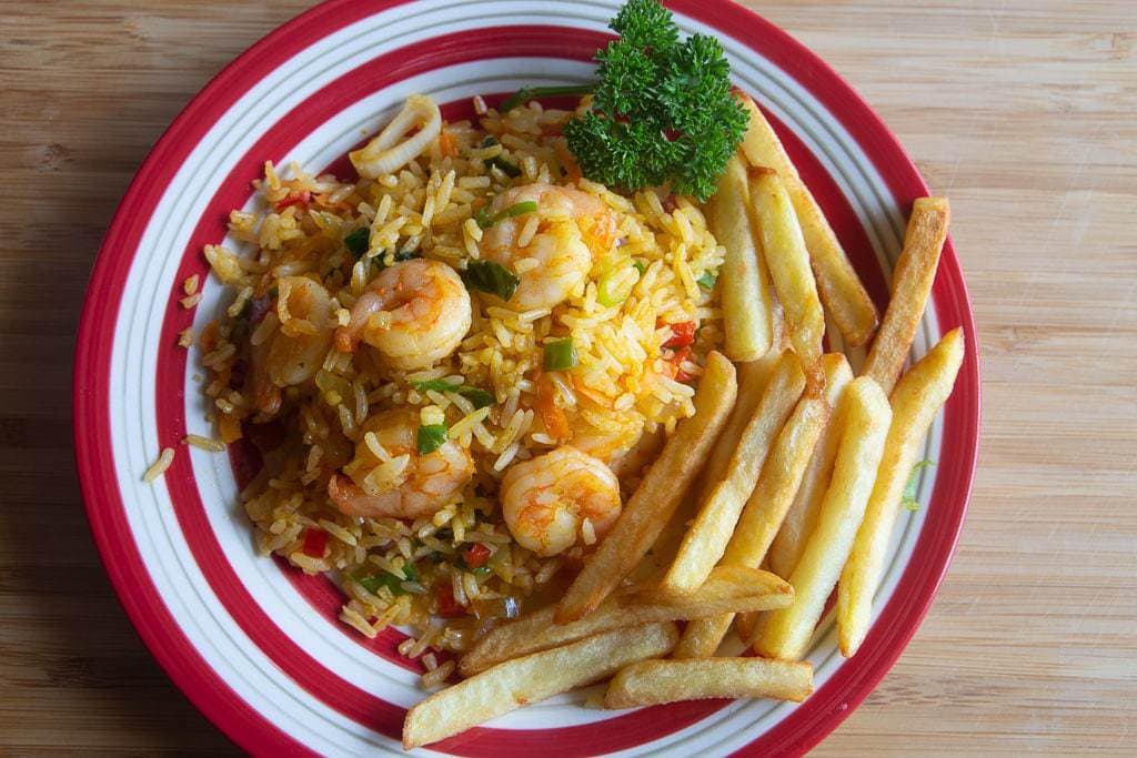 rice with shrimp, french fries and parsley garnish