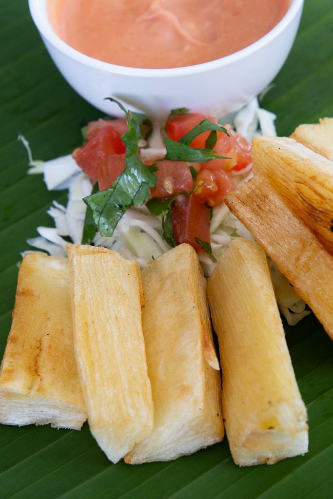pink sauce with yuca fries on banana leaf from costa rica