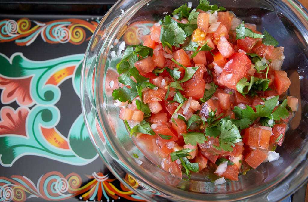 Lime juice with white onion, cilantro and onion chimichurri tico.
