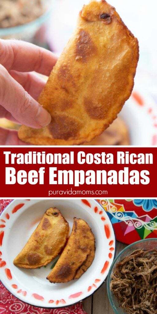 A hand holding up one of the beef empanadas.