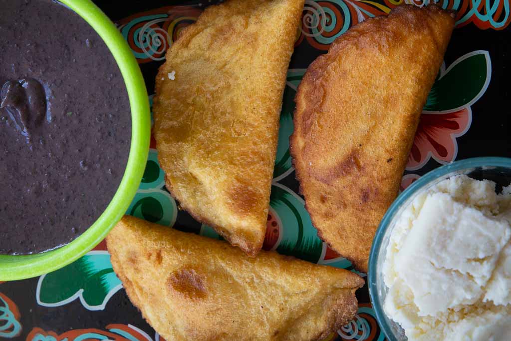 Fresh homemade bean and cheese empanadas.