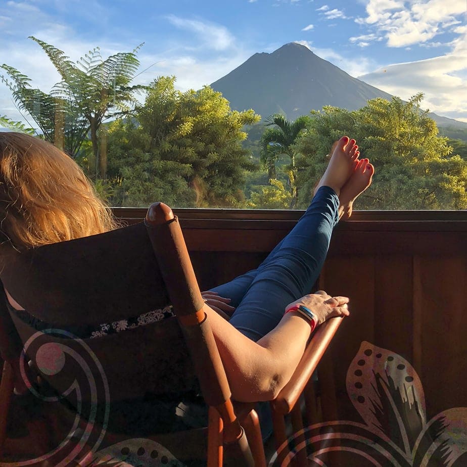 arenal-crop-home A women sitting on a lounge chair.