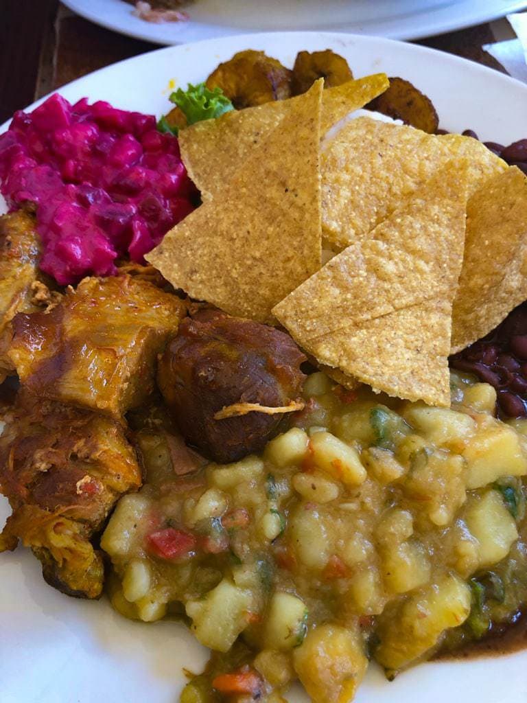 Casado platter topped with tortilla chips.