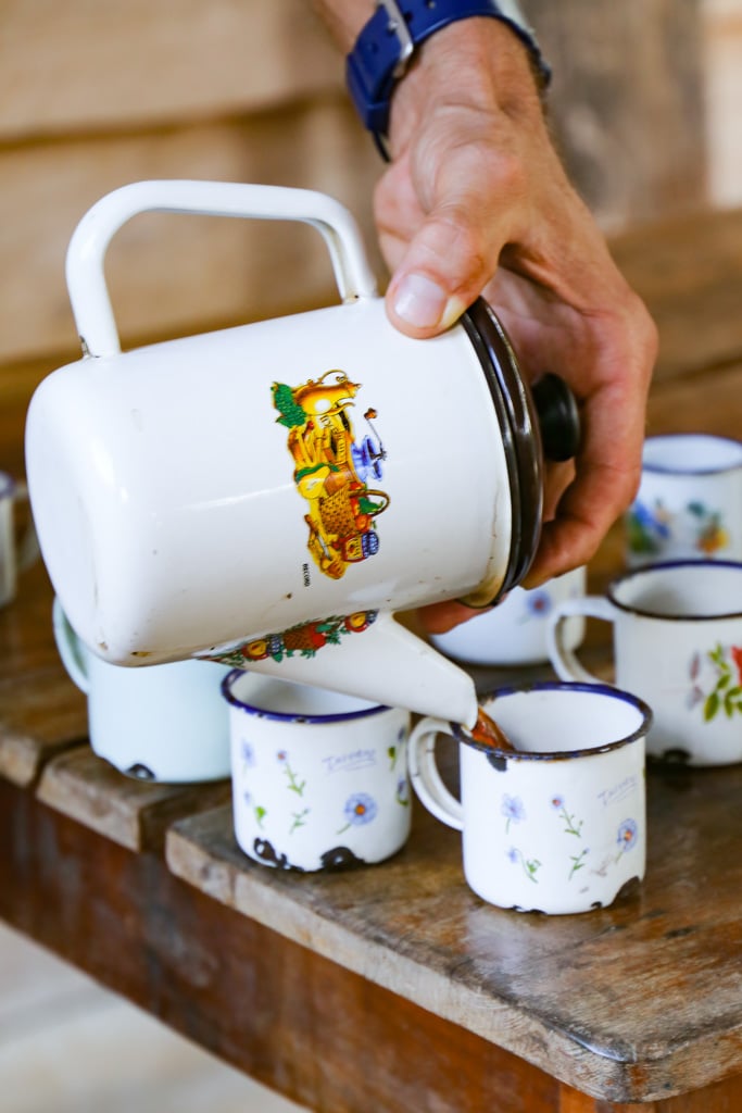 pouring coffee from a white pitcher