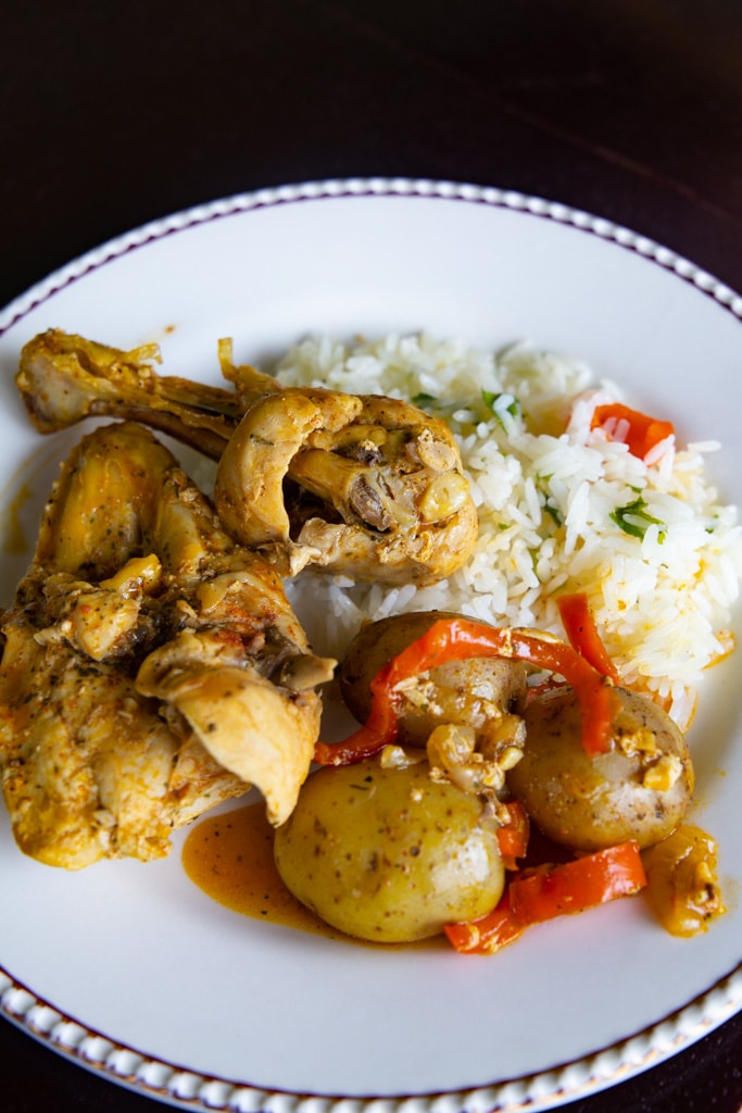 Costa Rican Chicken With Achiote with a black background
