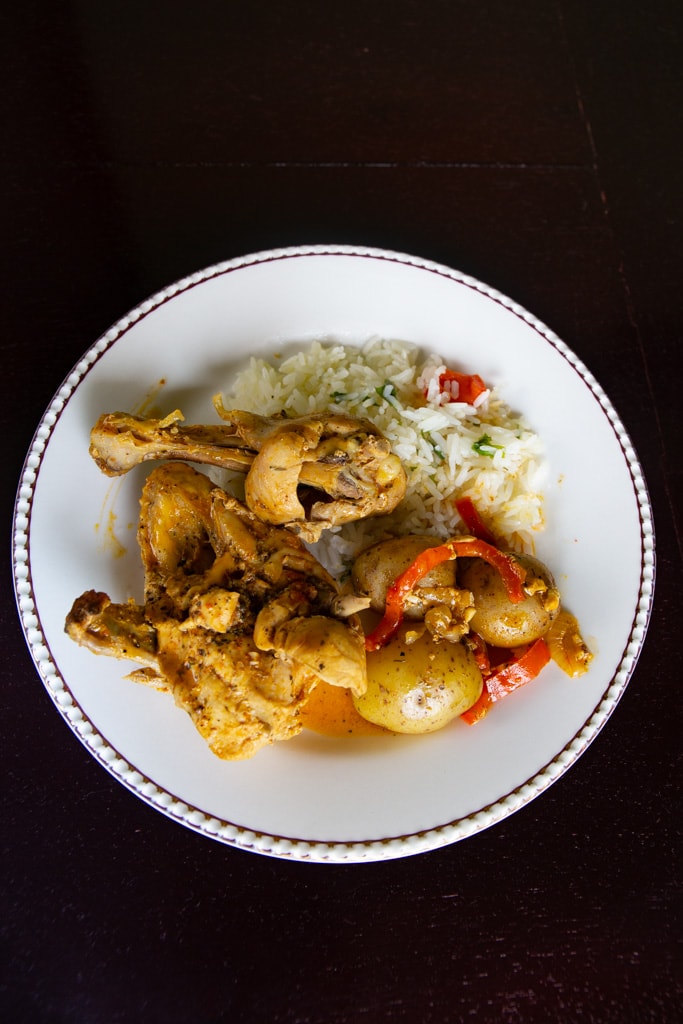 Costa Rican Chicken With Achiote with a black background