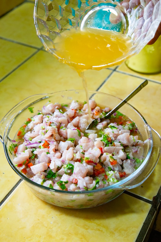 Chop sticks in a fish ceviche serving bowl.